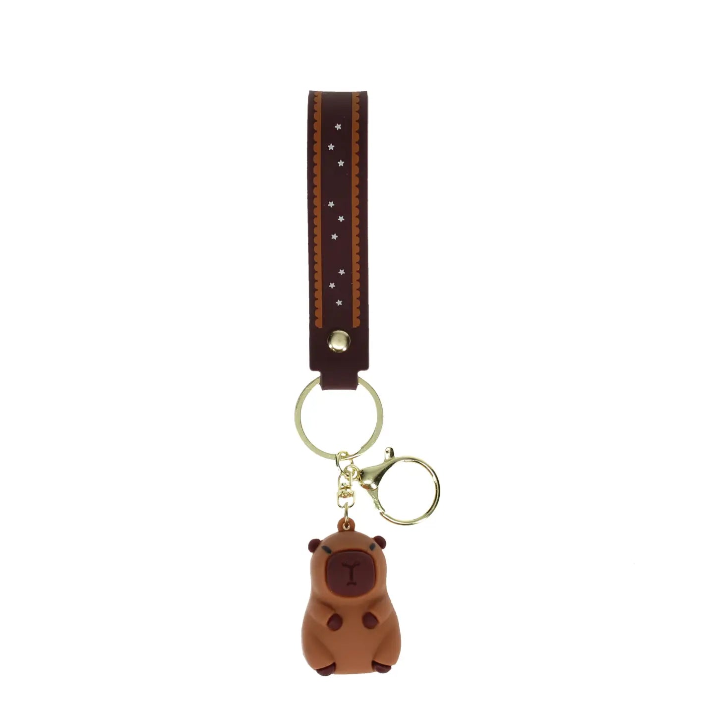 Full-length capybara keyring with brown patterned strap and gold ring.