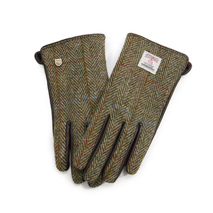 Chestnut herringbone Harris Tweed ladies gloves with leather detailing laid flat. 