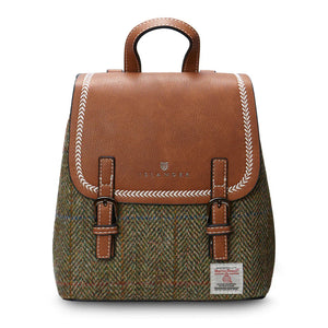 Chestnut herringbone Harris Tweed Mini Jura backpack with brown leather flap on white background.