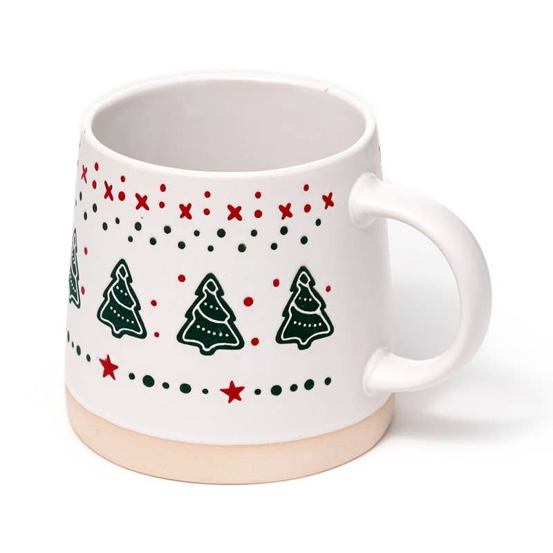 Side angle of Christmas Tree Tapered Stoneware Mug with Christmas pattern and cream base.