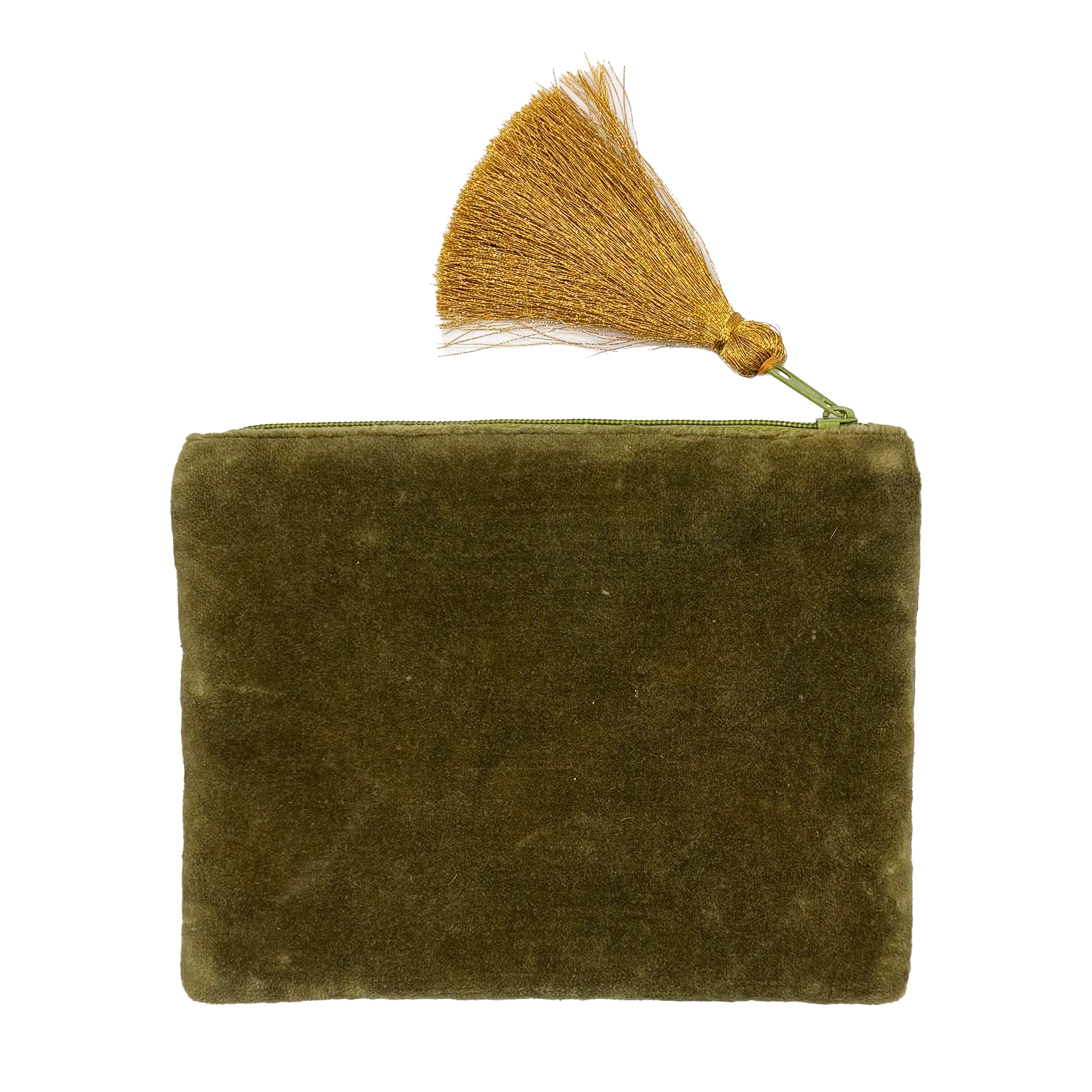 Green velvet back of bird pouch with gold tassel zip on pink background