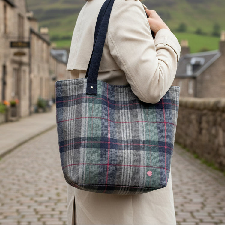 Drem Tweed Shopper Tote flat lay showing navy plaid pattern and straps