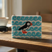 Puffin beaded purse with teal background and coastal rock design