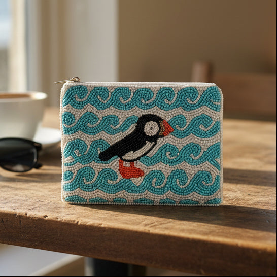 Puffin beaded purse with teal background and coastal rock design