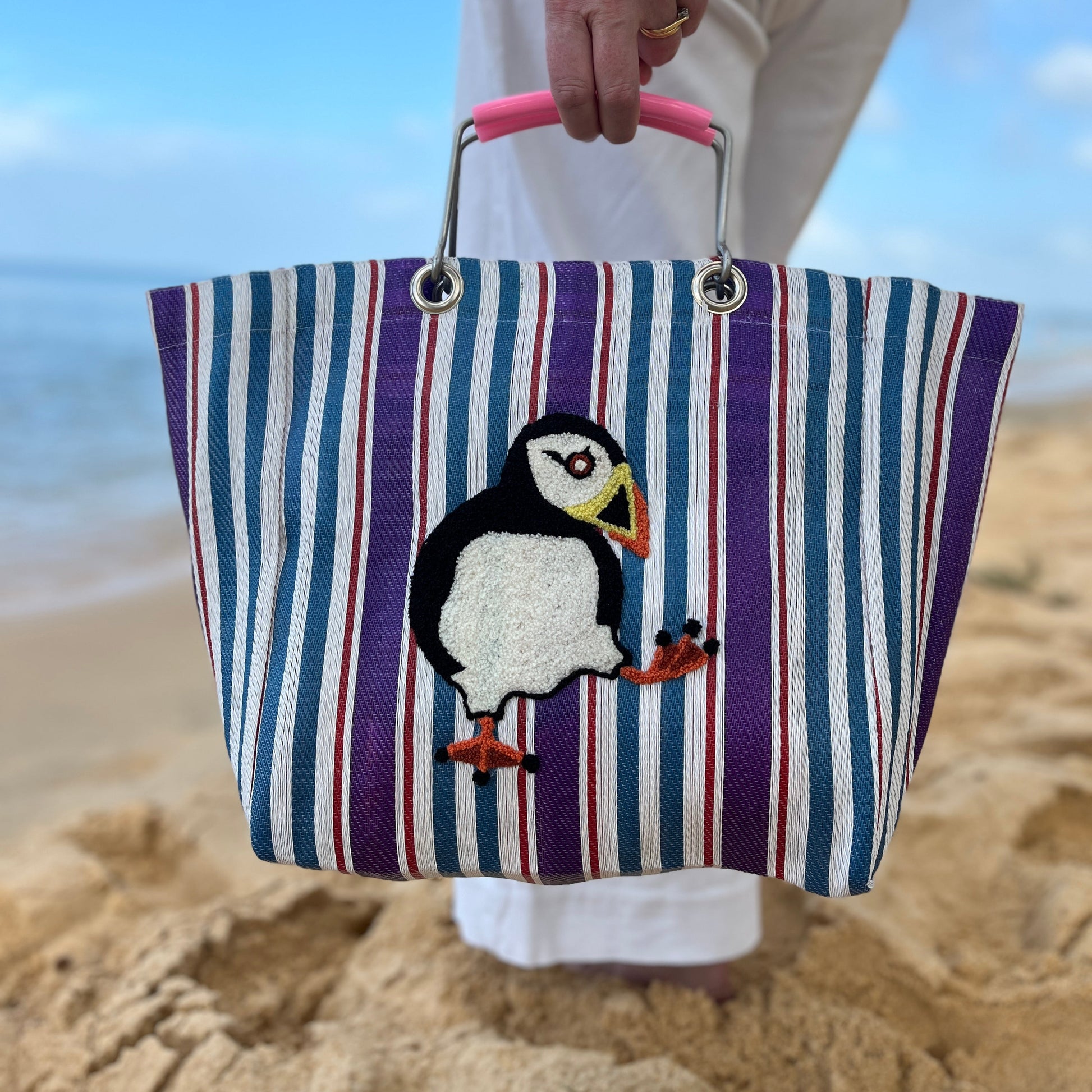 Puffin stripe market tote bag with embroidered bird on beach