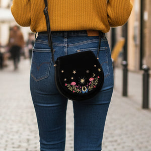 Black Dove and Floral Star Velvet Embroidered Saddle Bag front view showing white dove and pink floral embroidery