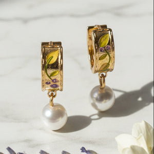 Blackberry Bramble pearl drop gold earrings with enamel detail on marble surface