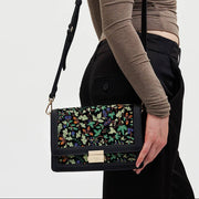 Cathy embroidered bag worn crossbody by model showing styling