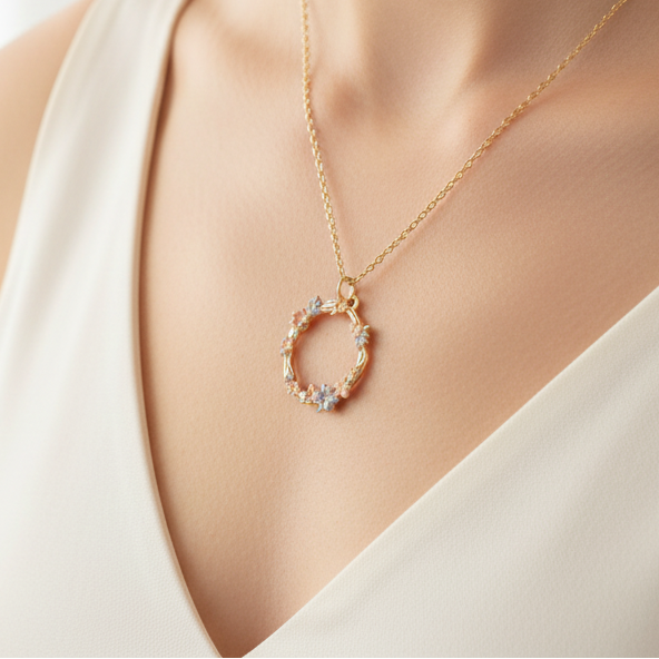Hibiscus enamel necklace worn on model with white top