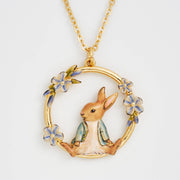 Peter Rabbit forget-me-not pendant close-up showing enamel detail on white background