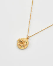 Fable England running bunny locket necklace in gold on white background