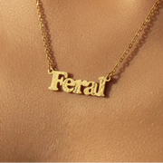 Gold feral necklace worn around neck on model