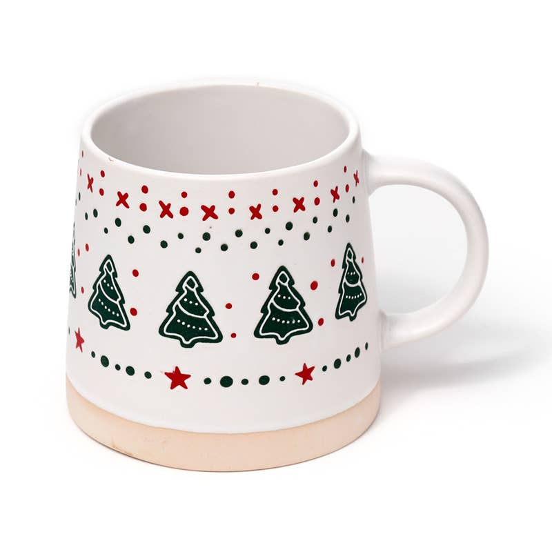Festive ceramic mug with red and green Christmas tree pattern and curved handle, shown from an angle.