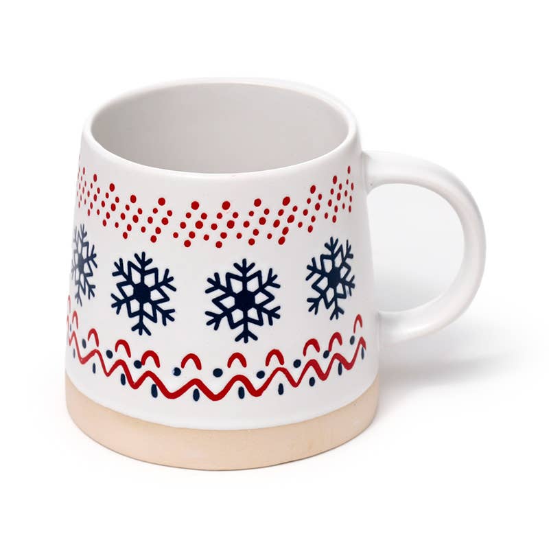 Festive ceramic mug featuring navy snowflakes and red dotted accents.