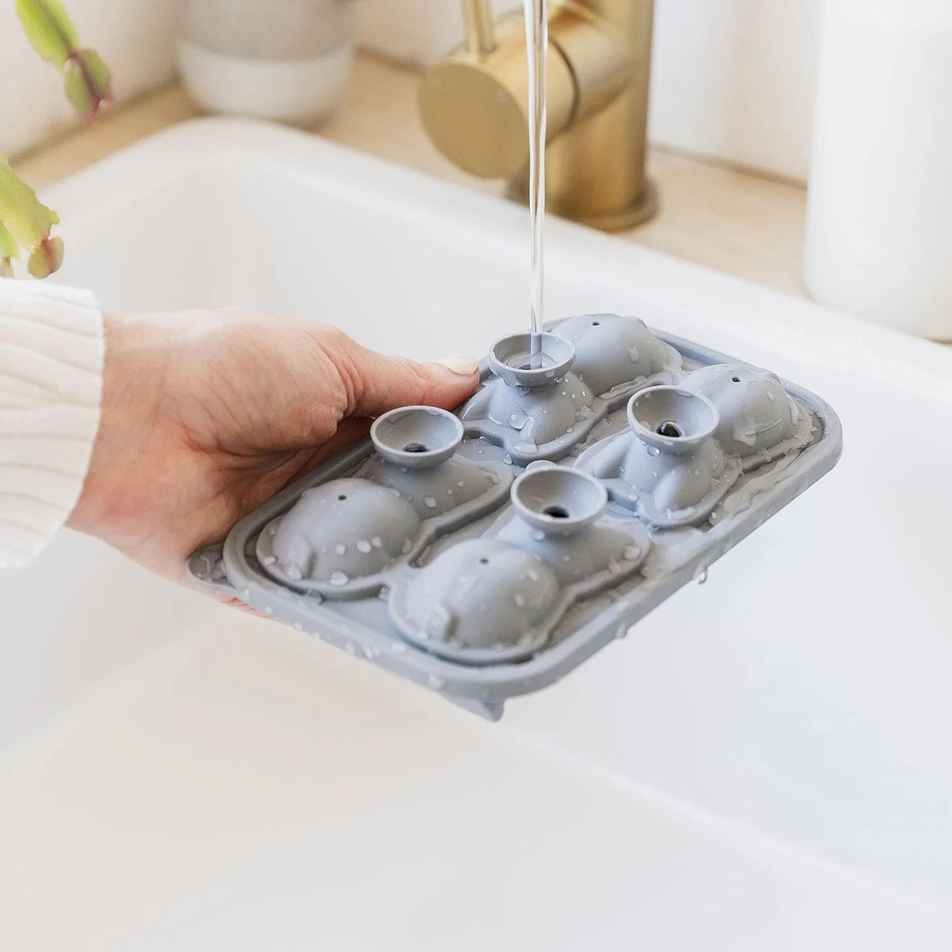 Filling Frenchie dog ice cube tray with built-in funnel