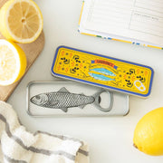 Fish bottle opener on sardine tin with Mediterranean lemon styling