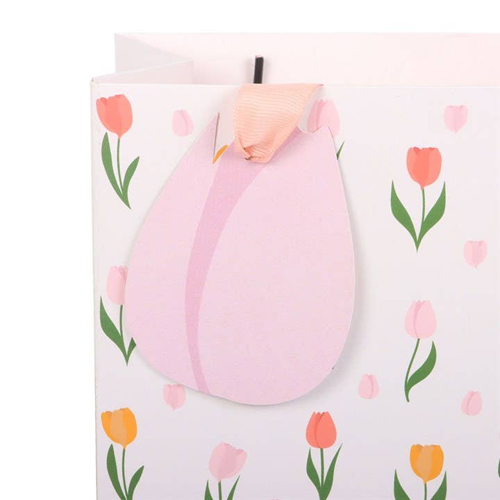 Floral gift bag with tulip design and ribbon handles