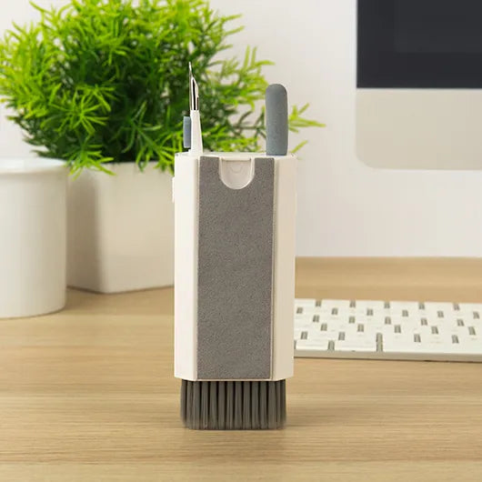 Gadget cleaner standing upright showing built-in tools.