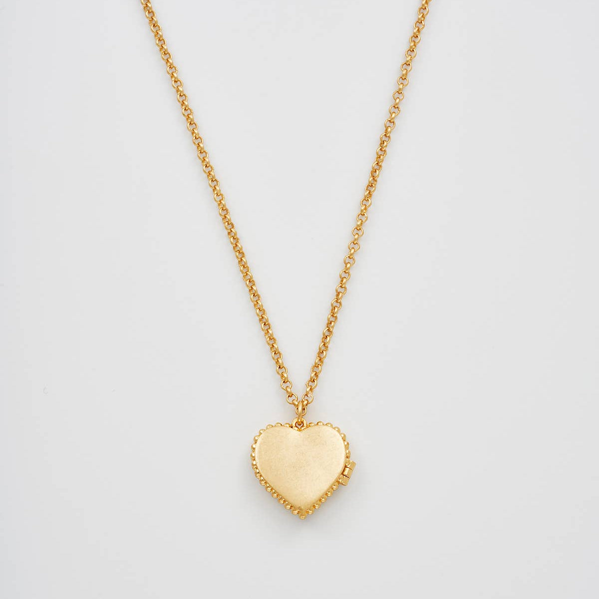 Gaia Lily Heart Locket Necklace on gold chain, front view against a white background.