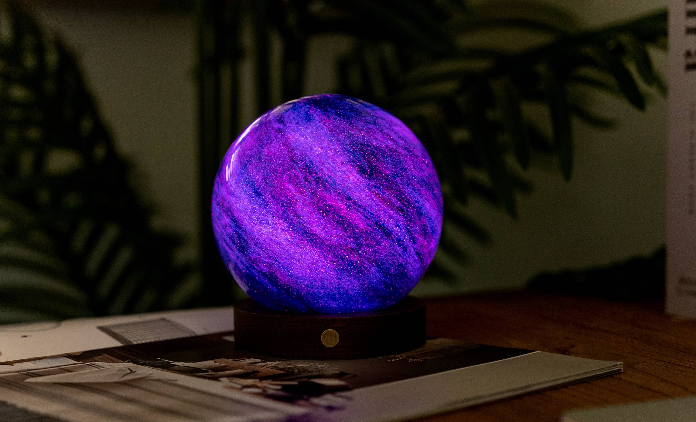 AstraGlass Galaxy Breeze light glowing deep purple on a desk at night