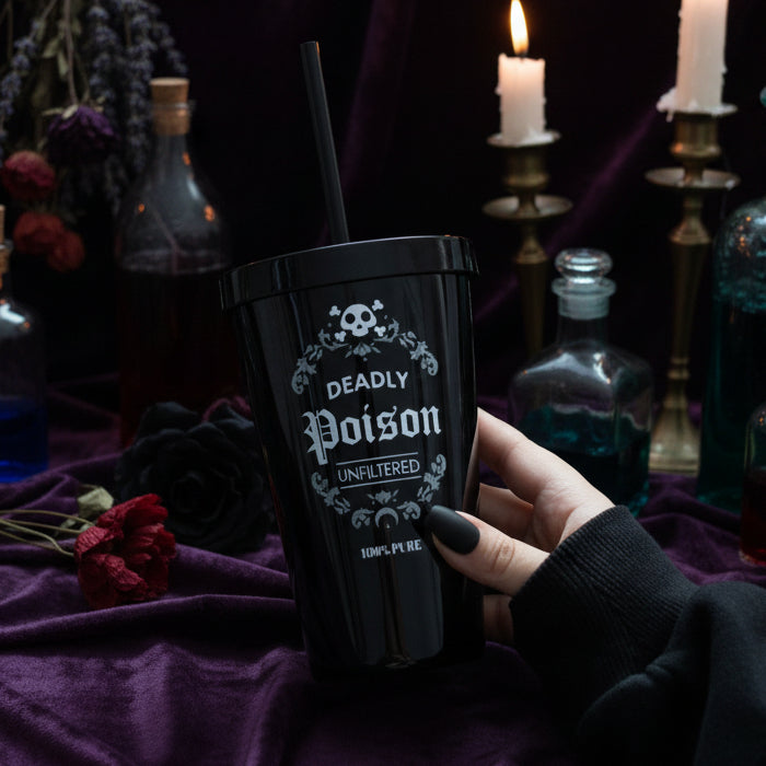 Gothic Deadly Poison black tumbler with candles in dark setting