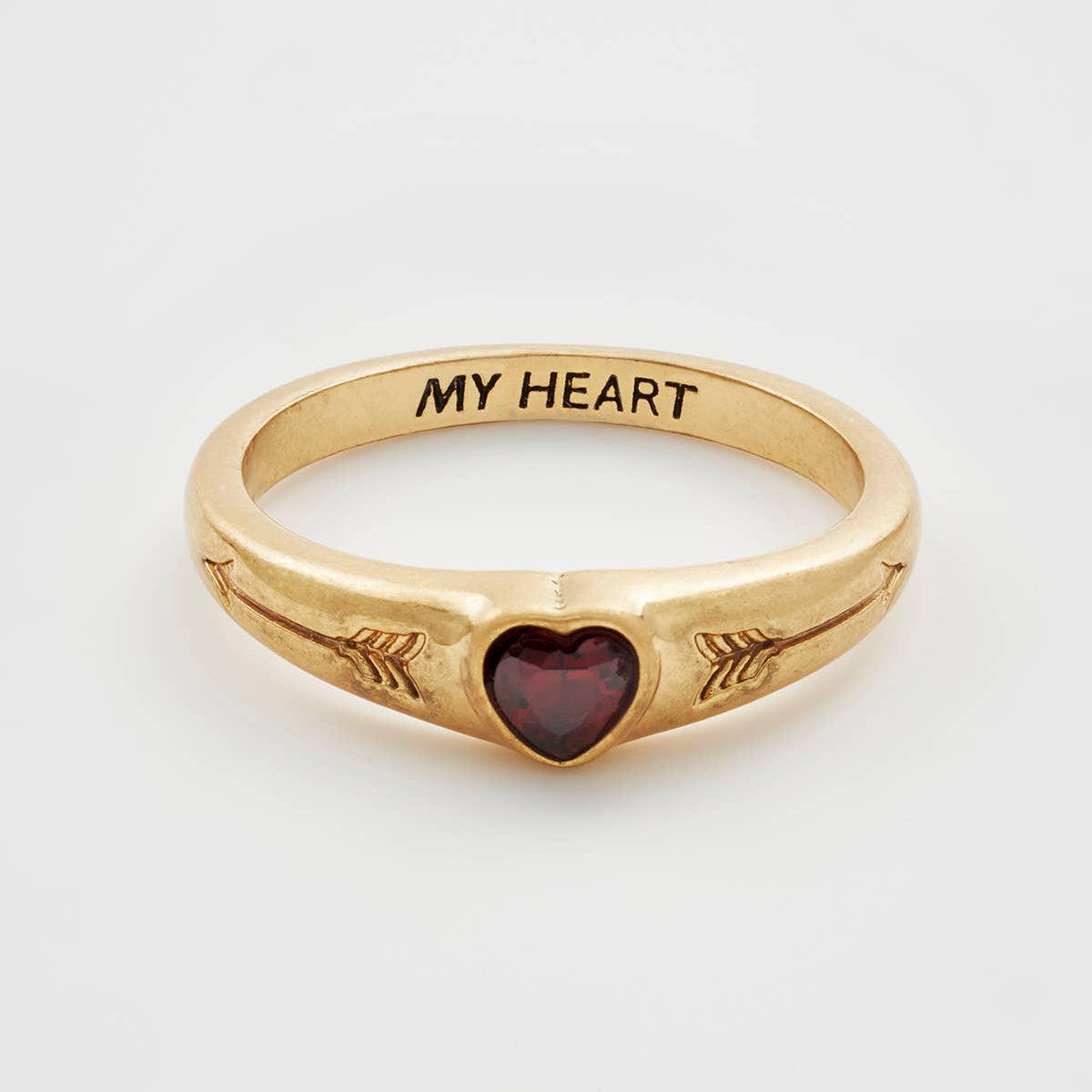 Gold signet ring with red heart stone and My Heart engraving.