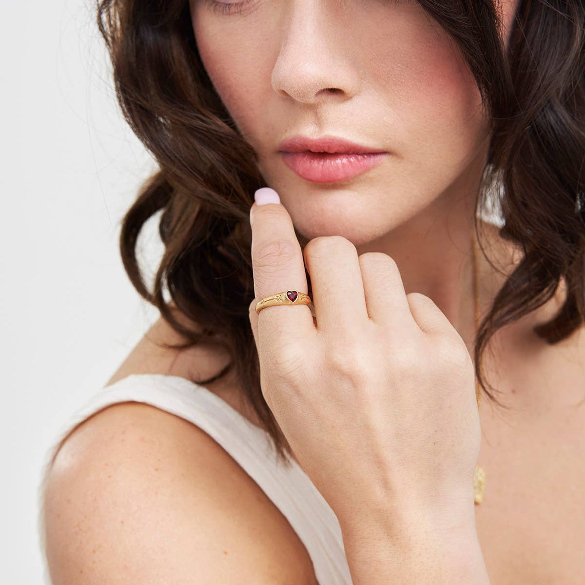 Model wearing the gold heart signet ring on her finger.