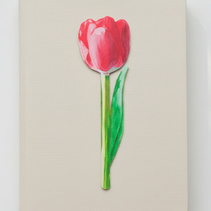 Painted pink tulip bookmark on cream linen textured surface