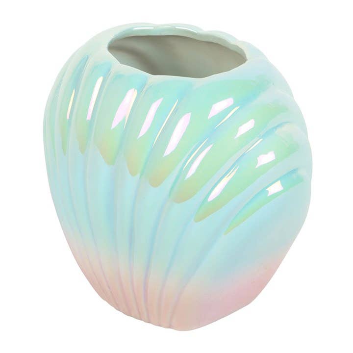 Close up of shell vase showing iridescent blue pink finish