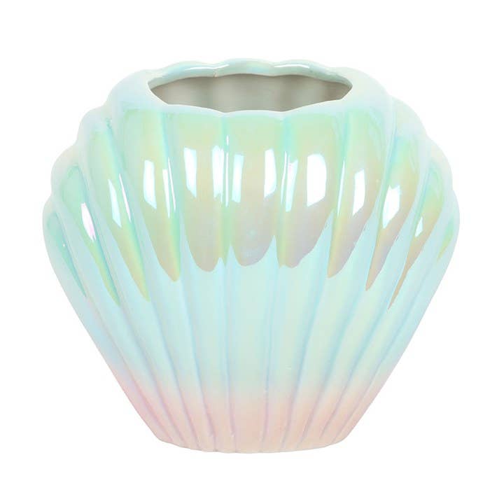 Pearlescent shell shaped vase showing blue pink iridescent finish