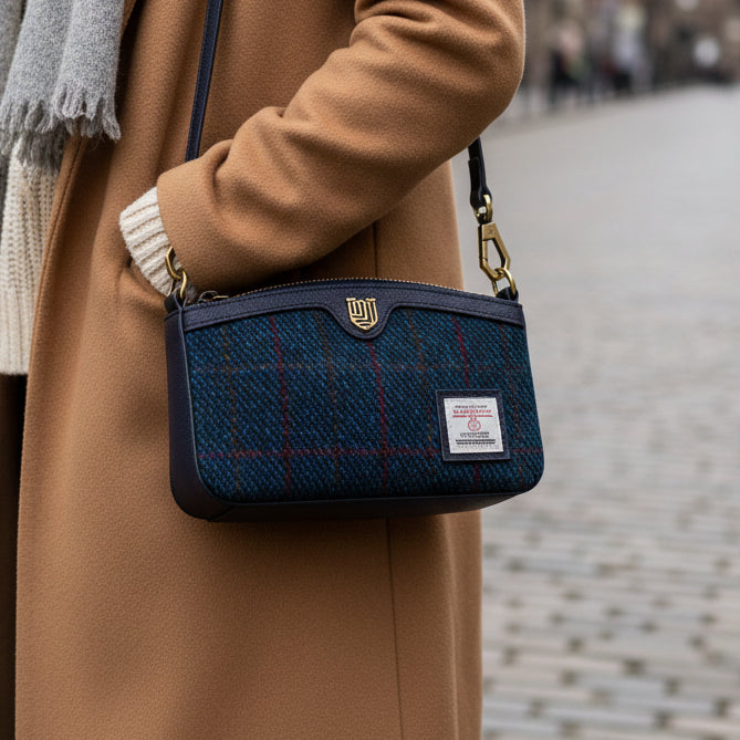 Ailsa navy over-check Harris Tweed purse worn crossbody on city street