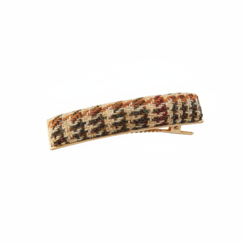 Beige dogtooth Harris Tweed barrette clip angled on white background