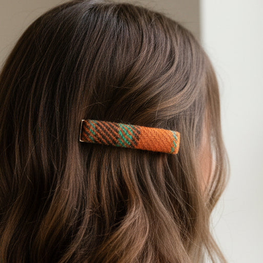 Harris Tweed orange and teal tartan barrette clip worn in brown hair