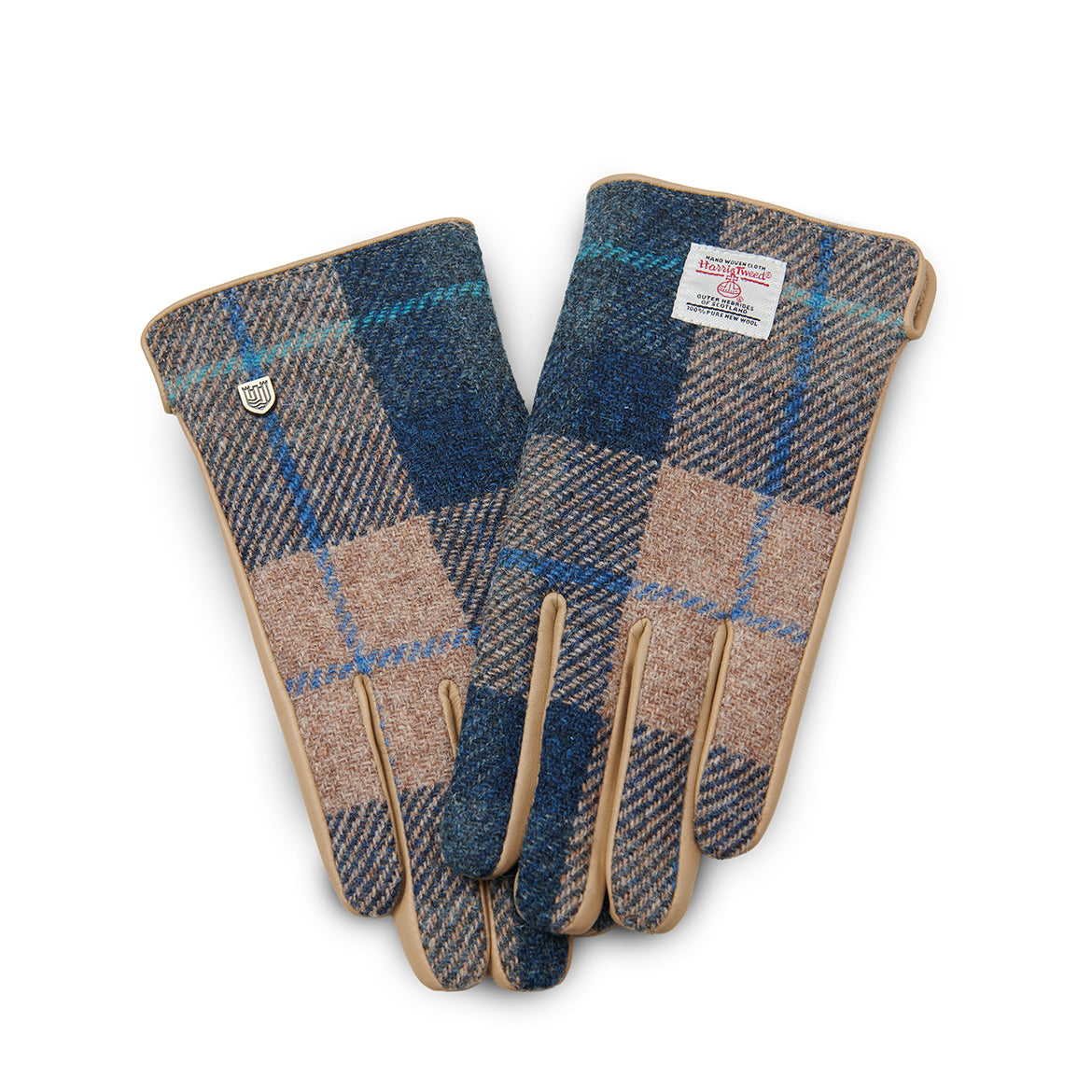 Navy beige tartan Harris Tweed gloves holding steaming mug on wooden fence outdoors
