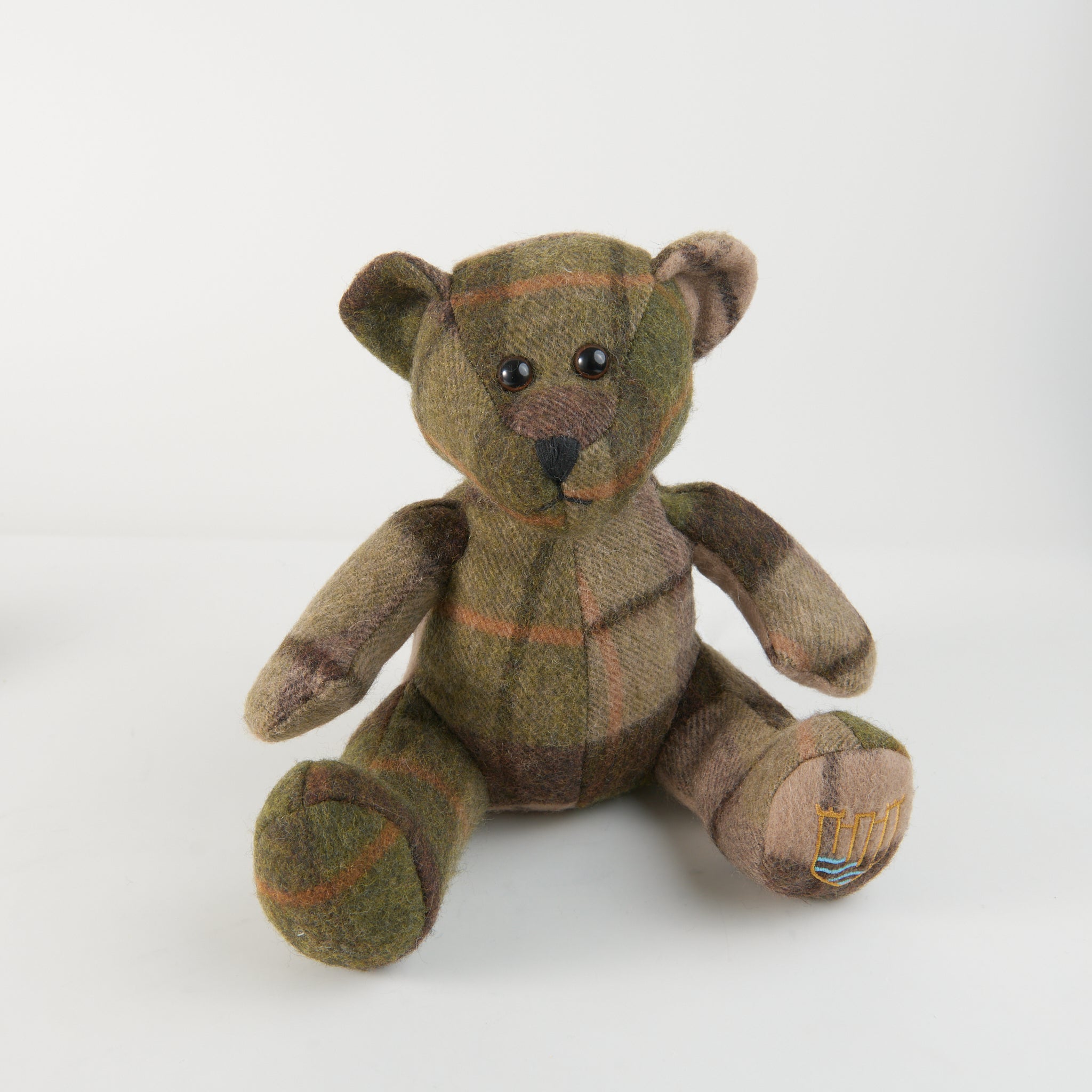 Lambswool teddy chestnut tartan front view on white background.