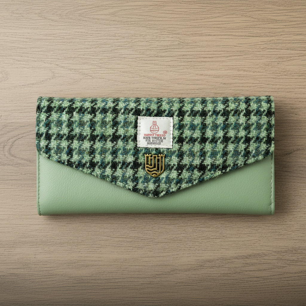 Green dogtooth Harris Tweed clasp purse with sage leather on light wood