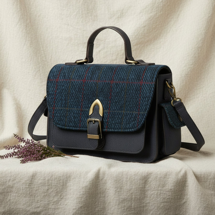 Navy Melrose crossbody in Harris Tweed with heather on linen backdrop