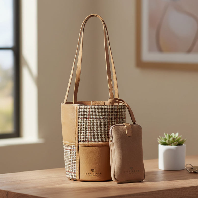Orlagh beige dogtooth Harris Tweed bucket bag on desk with succulent plant