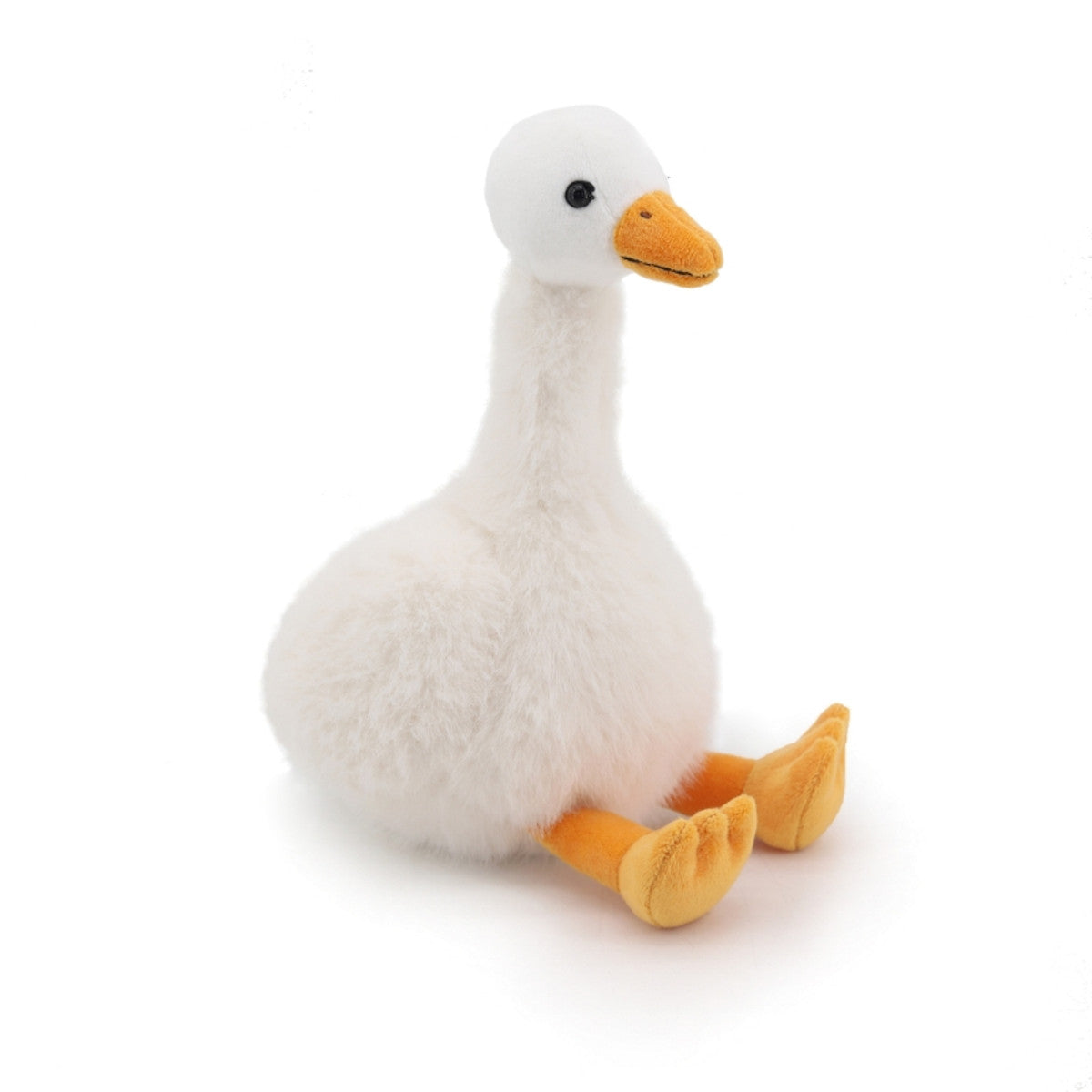 Cream goose plush toy side view showing orange beak and feet on white background