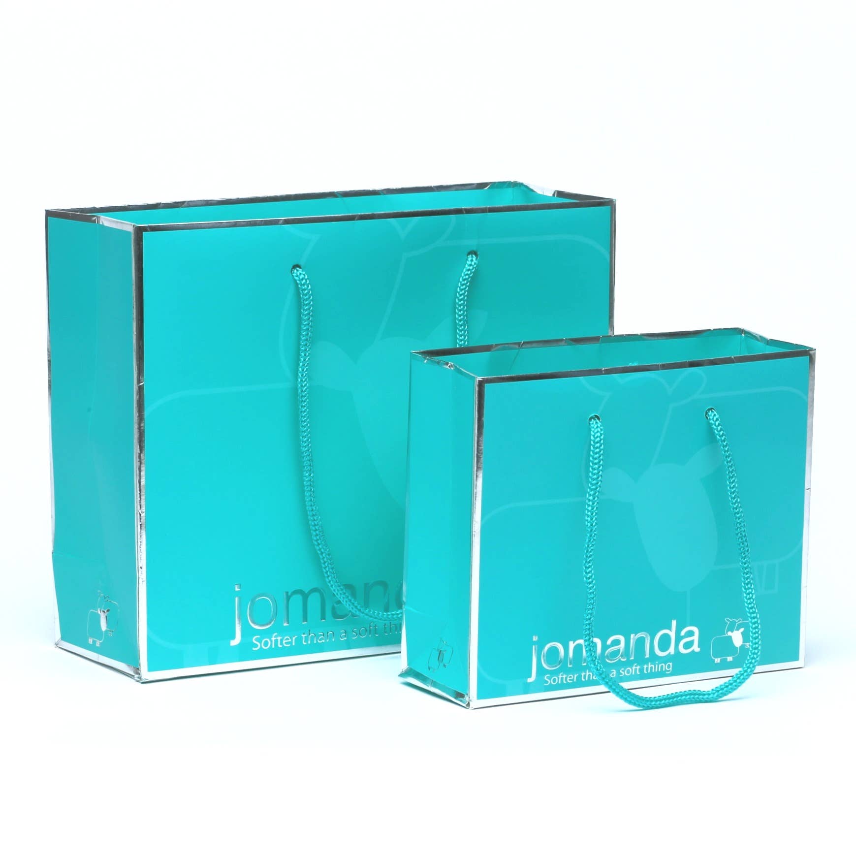 Jomanda teal gift bags in two sizes with silver trim on white background