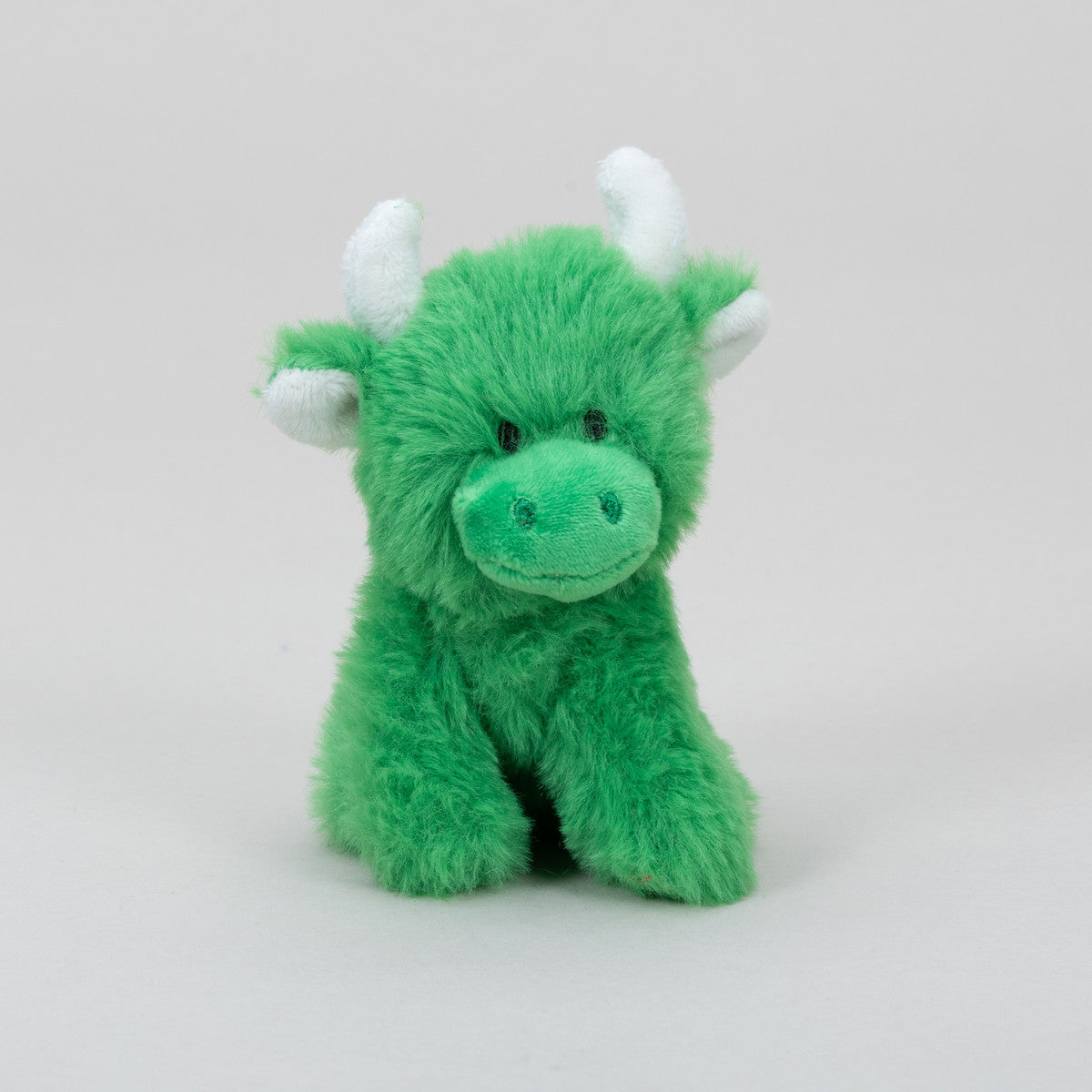 Green Highland cow collectible plush front view on grey background