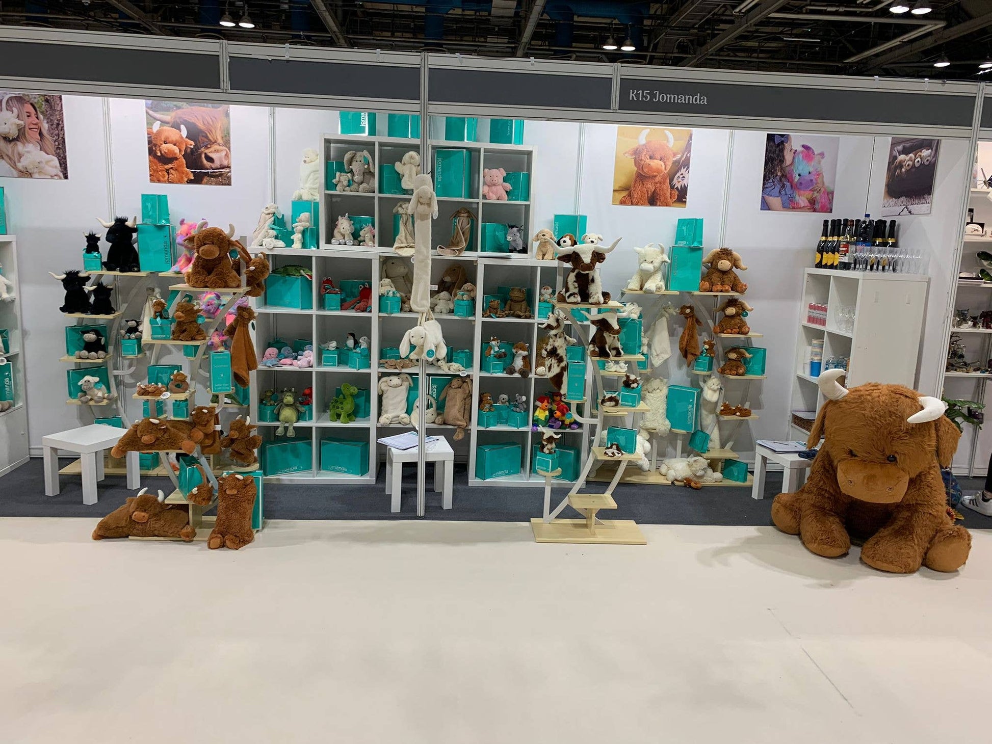 Jomanda soft toys trade stand with shelves of plush animals and gift boxes