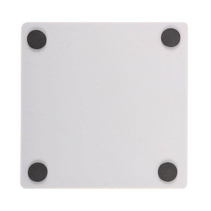 Underside of Let's Sacrifice Toby coaster showing four cork feet pads