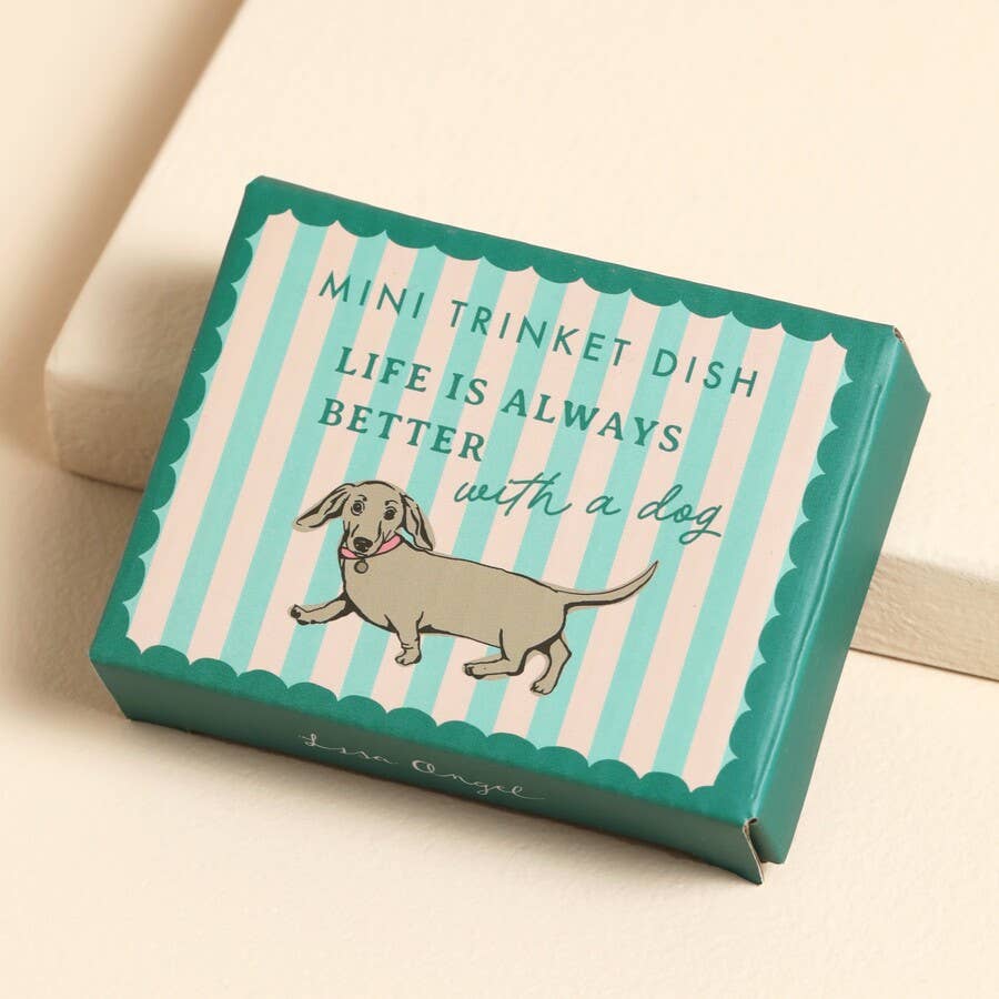 Green ceramic trinket dish box with dachshund illustration and the text “Life is always better with a dog”.
