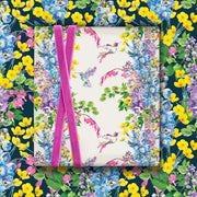 Hummingbird botanical gift wrap design on white background