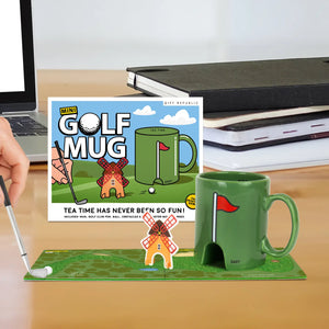 Green mini golf mug with putting coaster game set on desk