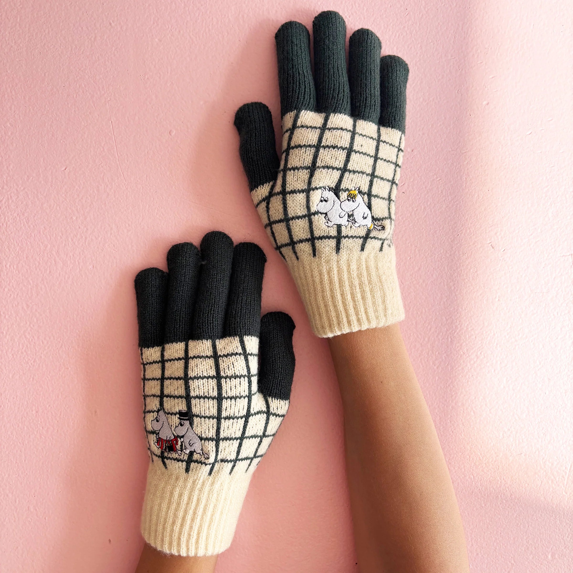Close-up of Moomin Chequered Gloves showing grid knit pattern and embroidered characters.
