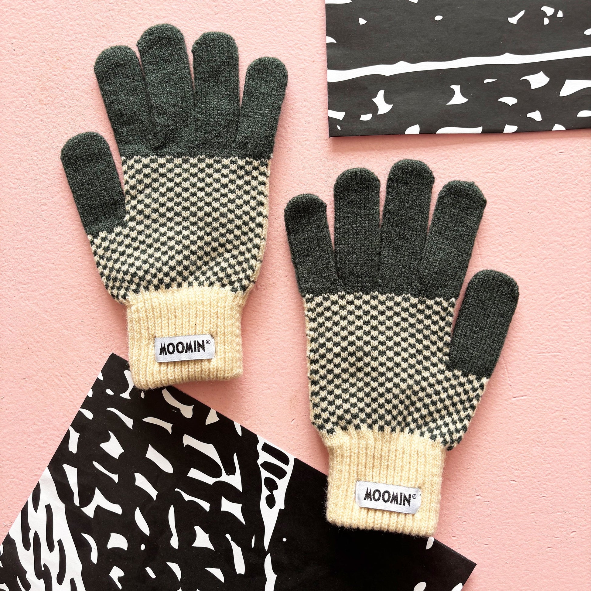 Back view of Moomin Chequered Gloves showing houndstooth knit and Moomin logo detail.
