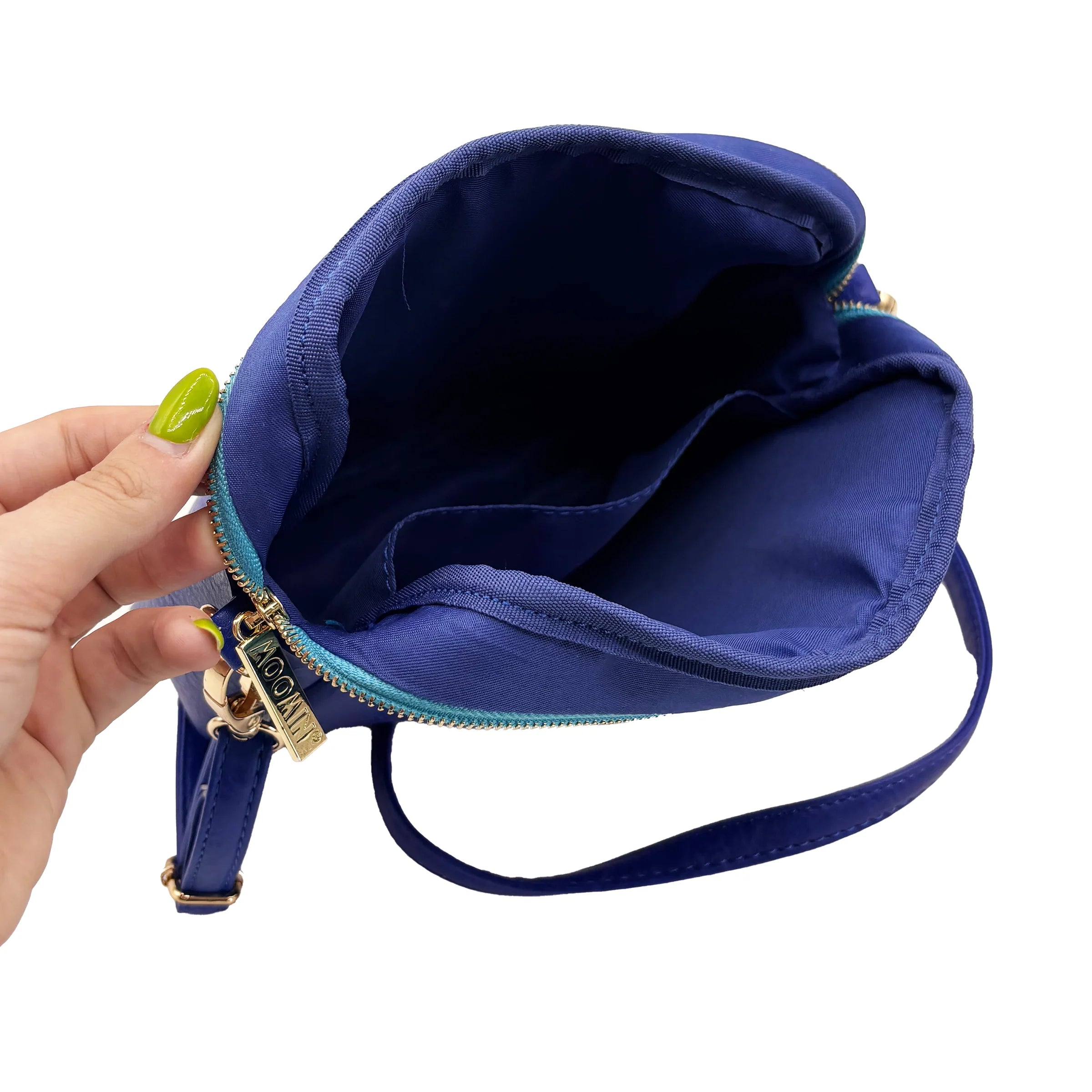 Interior view of Moomin Gold Mini Bag showing cotton lining and open pocket.
