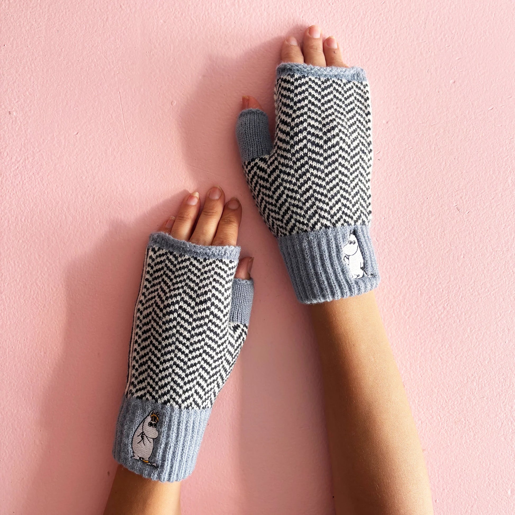 Close-up of Moomin Herringbone Gloves showing textured knit pattern and character embroidery.
